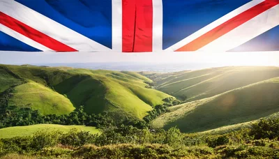 British Flag Over Rolling Green Hills Landscape