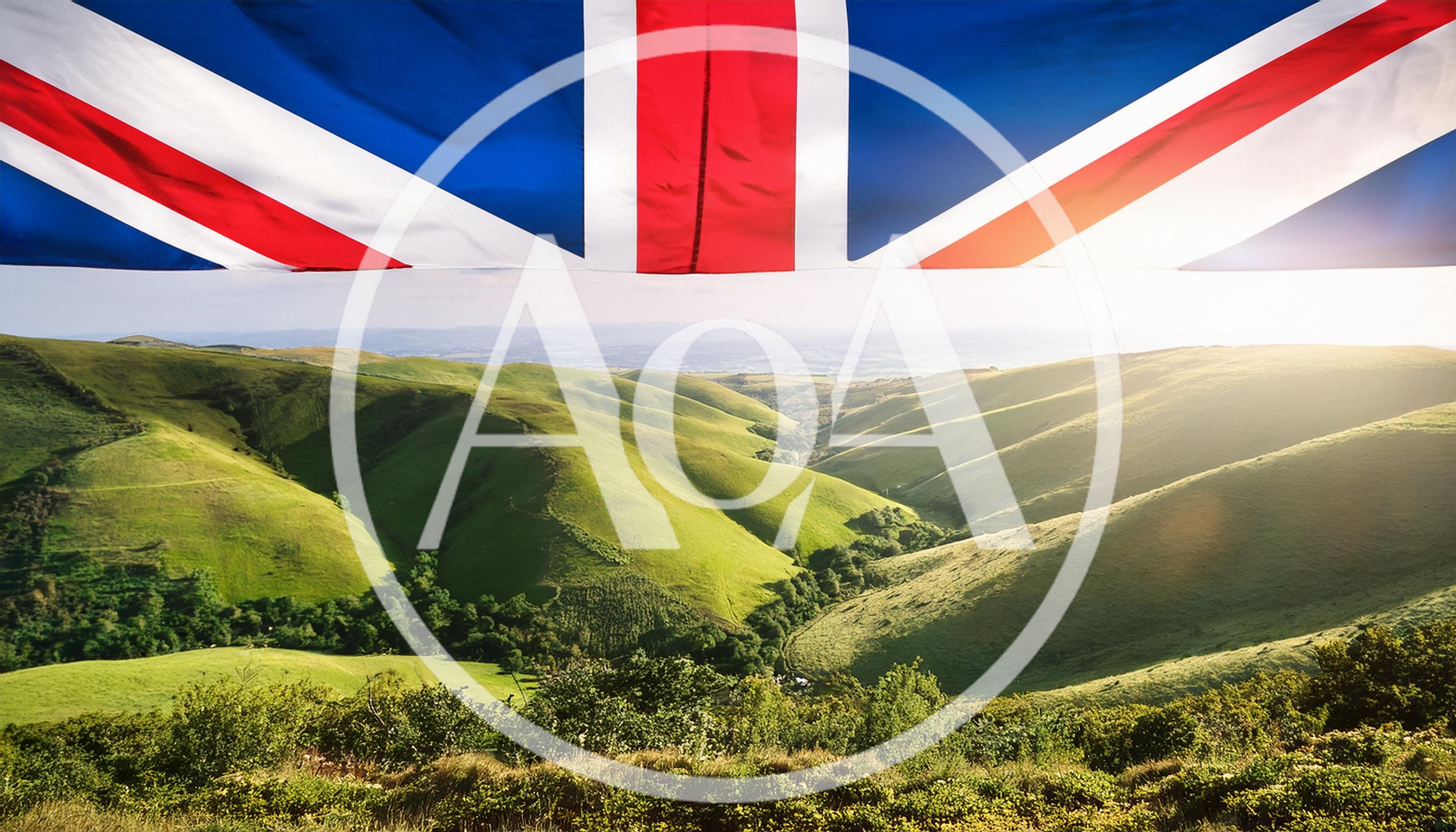 British Flag Over Rolling Green Hills Landscape