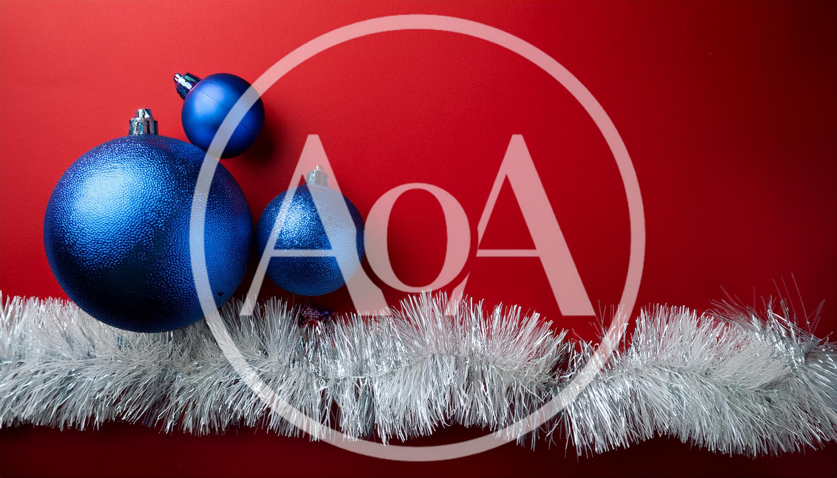 Blue Christmas Ornaments With Silver Tinsel On Red Background