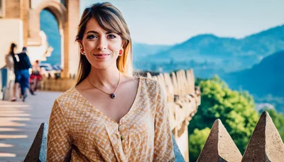 Young Woman Smiling On A Sunny Terrace