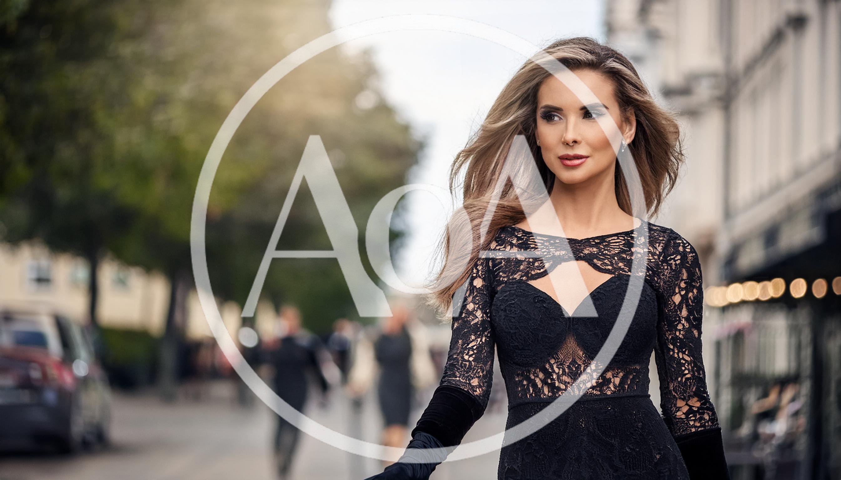 Elegant Woman Walking Down A City Street