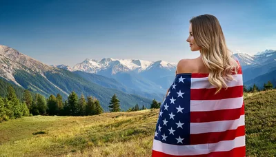 Woman Wrapped In American Flag Overlooking Mountain Landscape