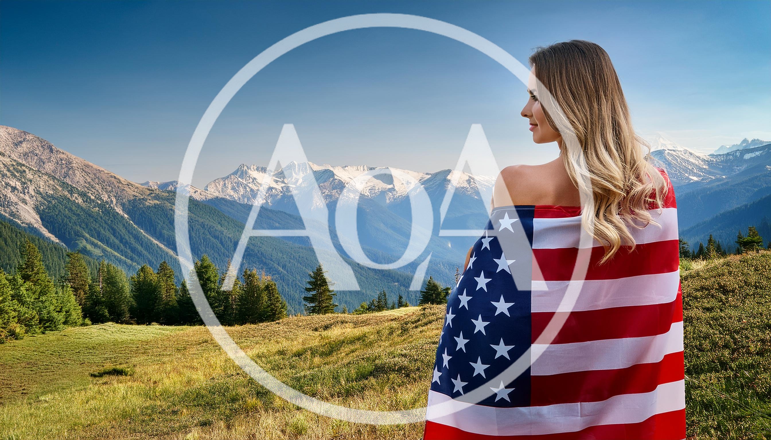 Woman Wrapped In American Flag Overlooking Mountain Landscape