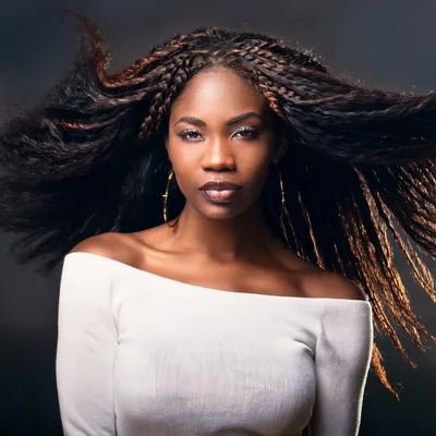 Portrait Of A Beautiful Woman With Flowing Braided Hair