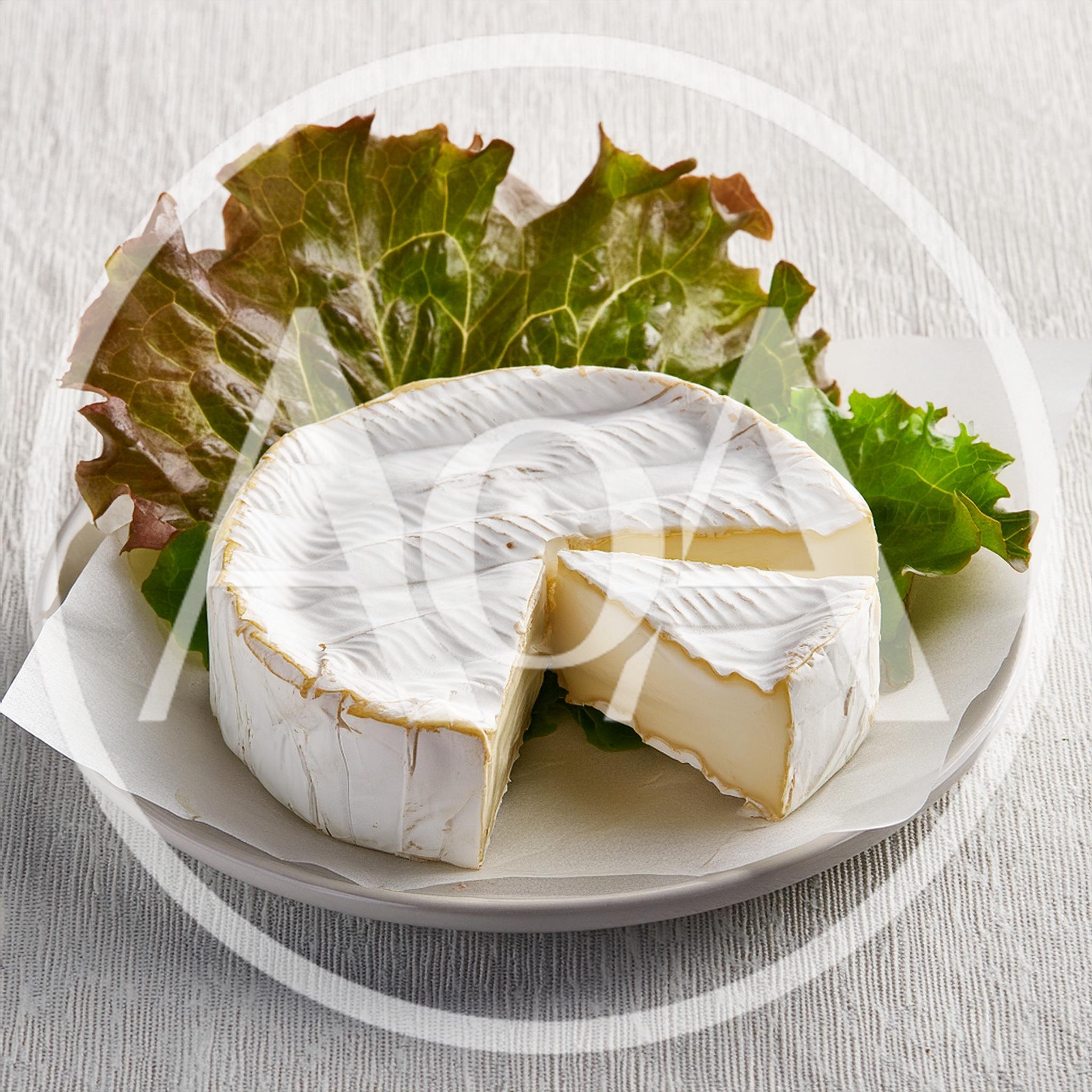 Wheel Of Brie Cheese With A Cut Slice