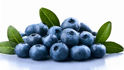 Fresh Blueberries With Green Leaves On A Wooden Surface