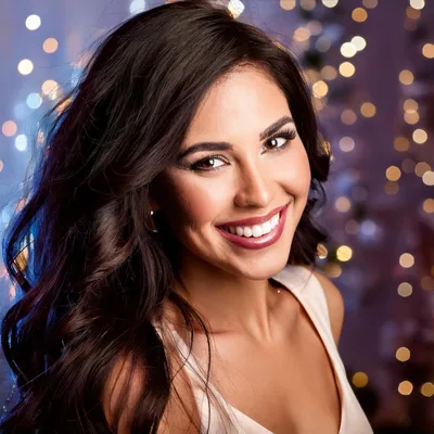 Portrait Of A Smiling Woman With Long Dark Hair