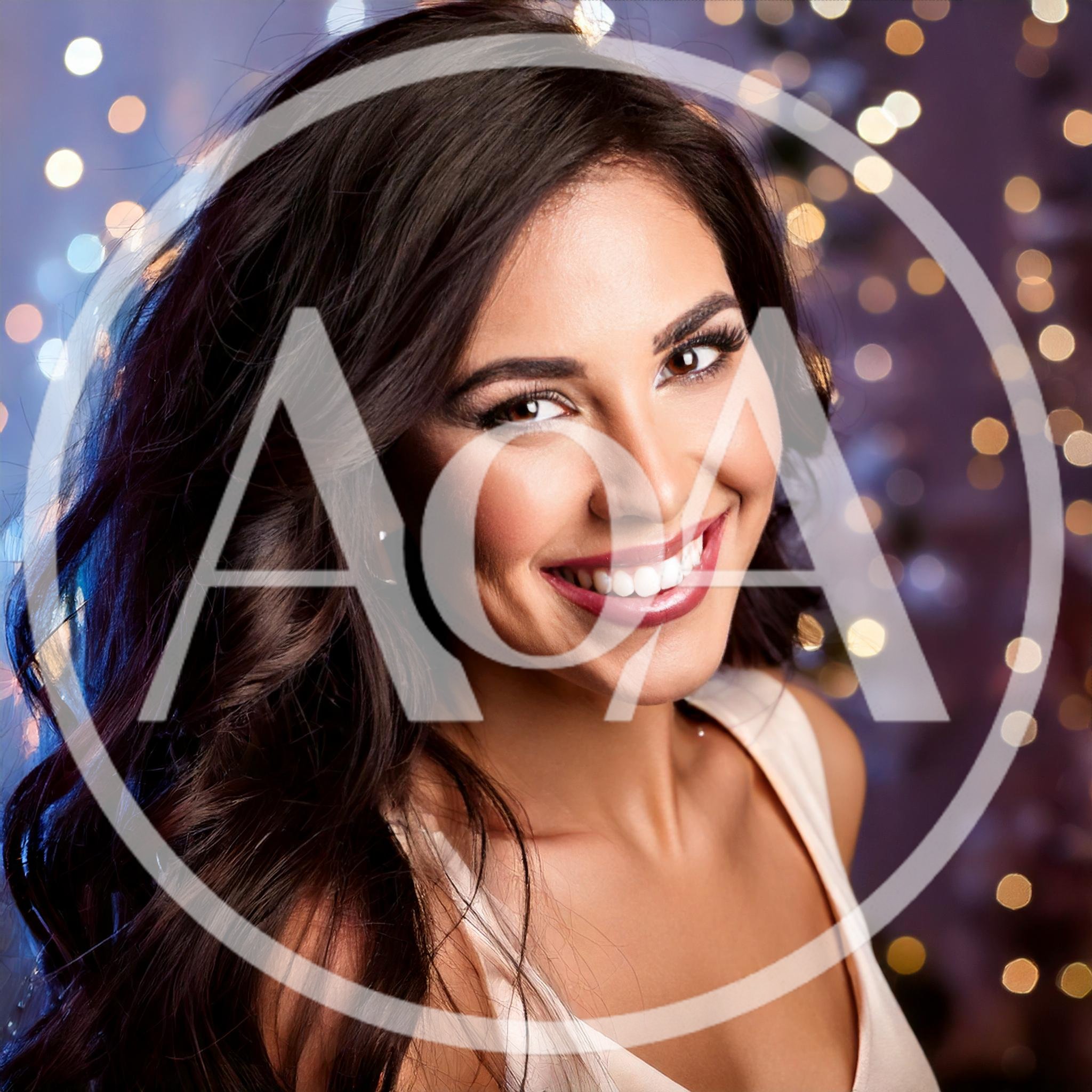 Portrait Of A Smiling Woman With Long Dark Hair