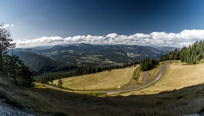 Panoramic View Of Mountain Landscape With Winding Road