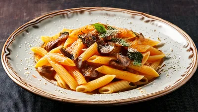 Penne Pasta With Mushrooms On A Decorative Plate