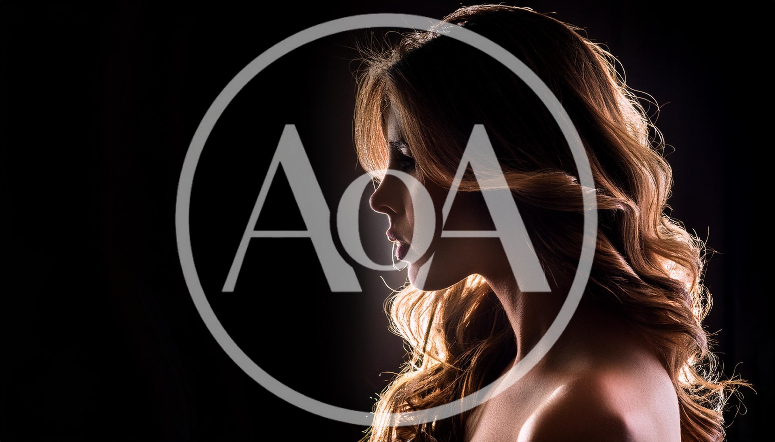 Profile Portrait Of A Woman With Backlit Hair