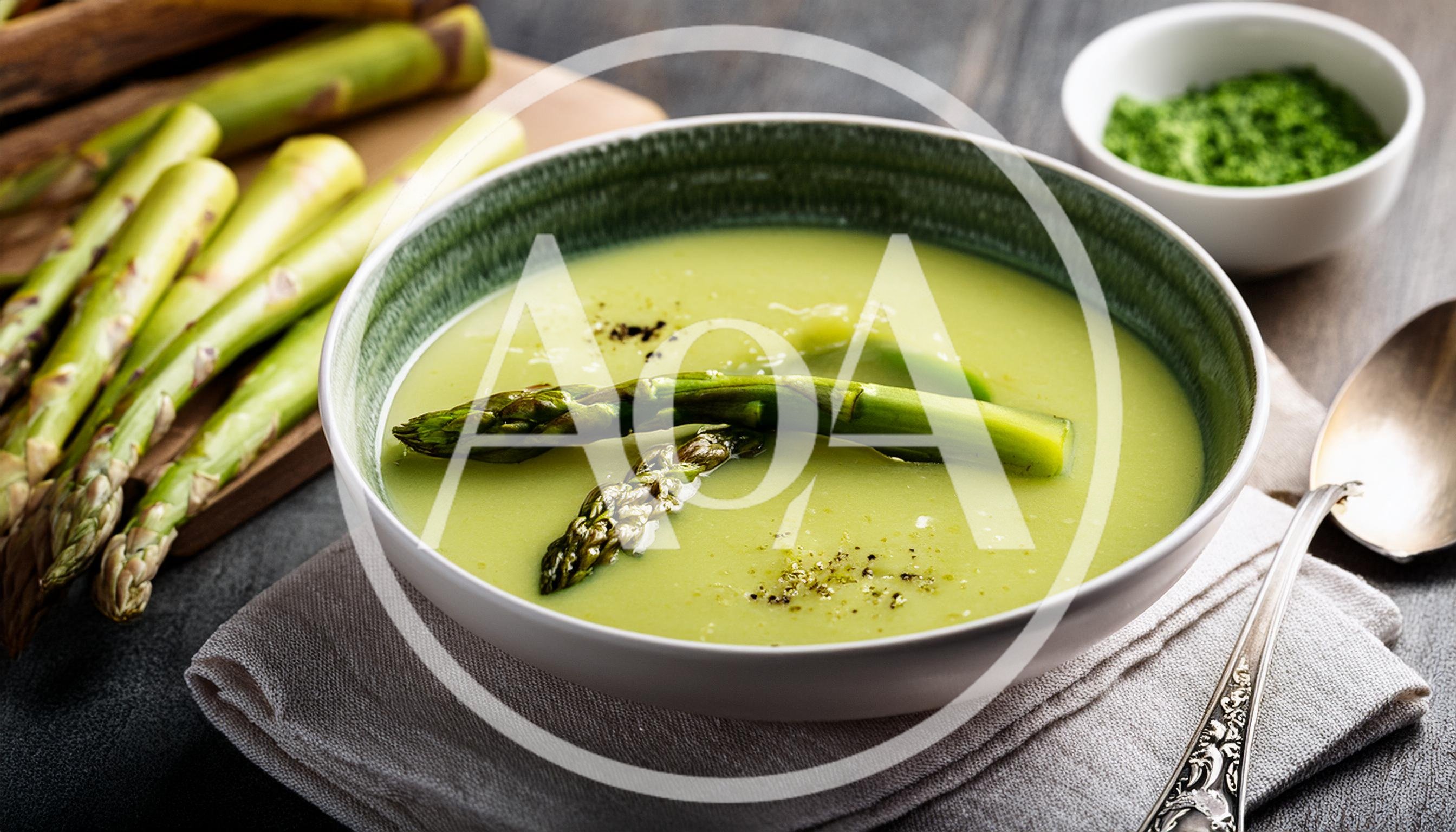 Bowl Of Creamy Asparagus Soup With Fresh Spears