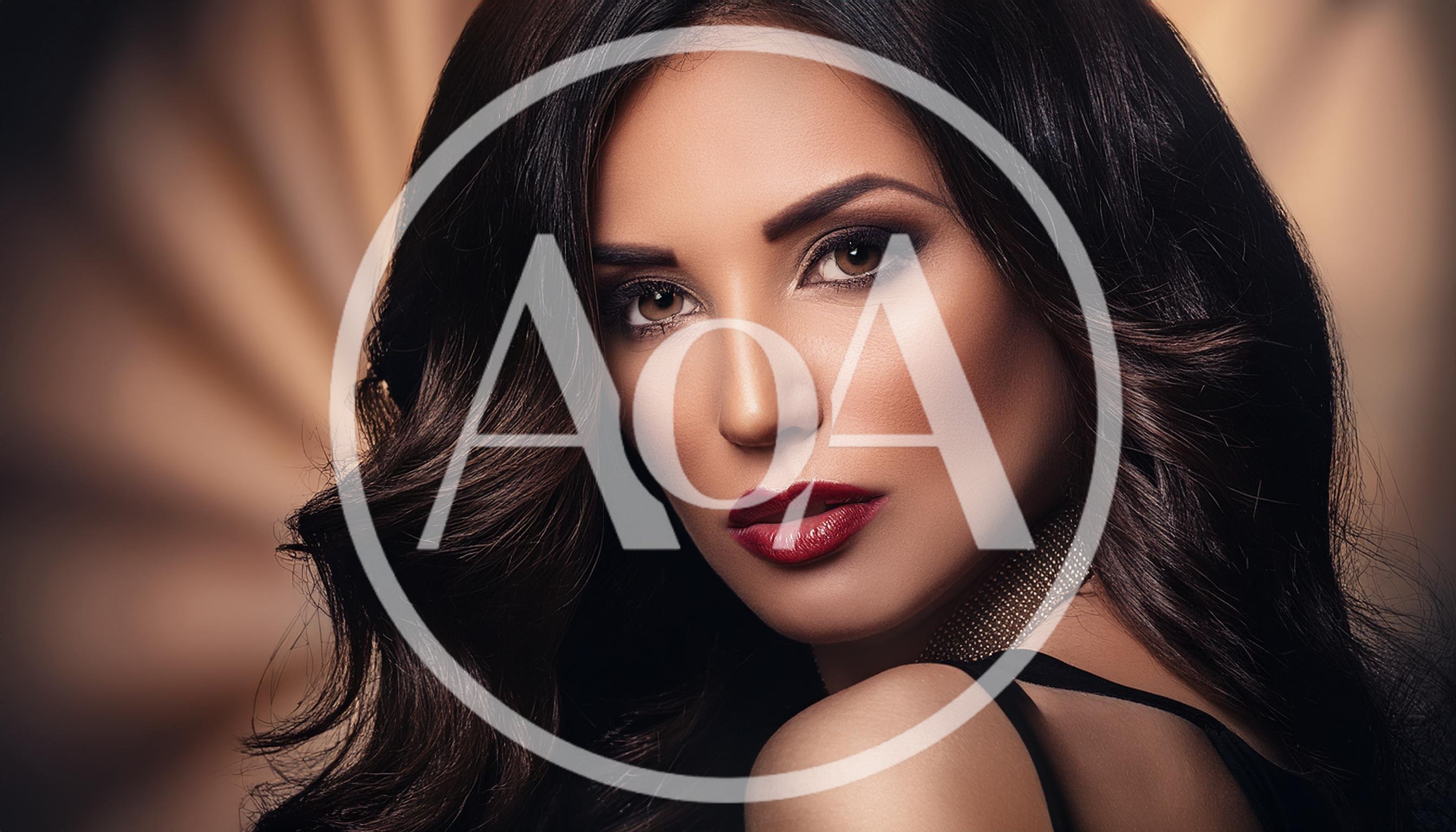 Portrait Of A Glamorous Woman With Dark Wavy Hair