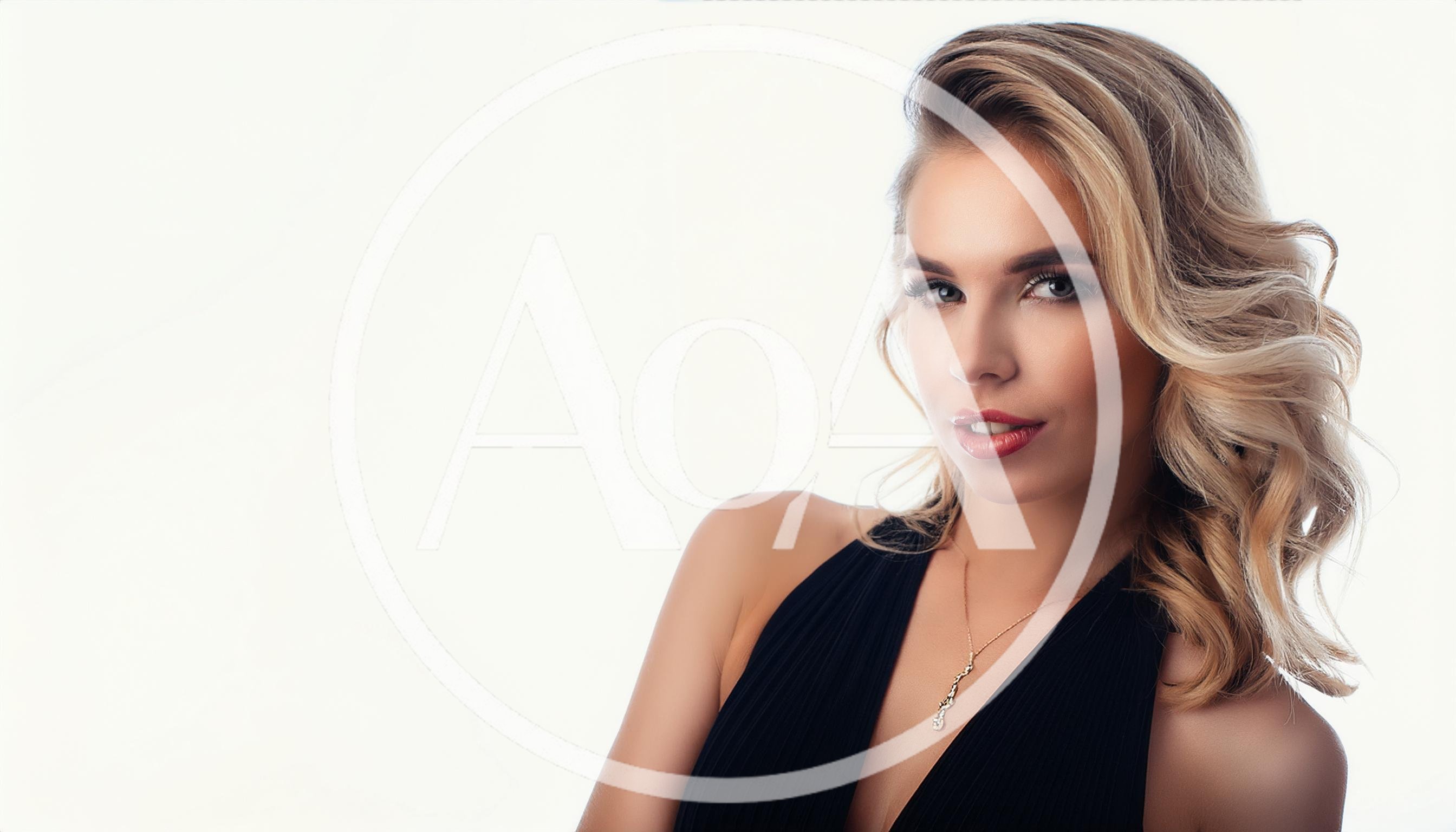 Portrait Of A Beautiful Blonde Woman In Black Dress