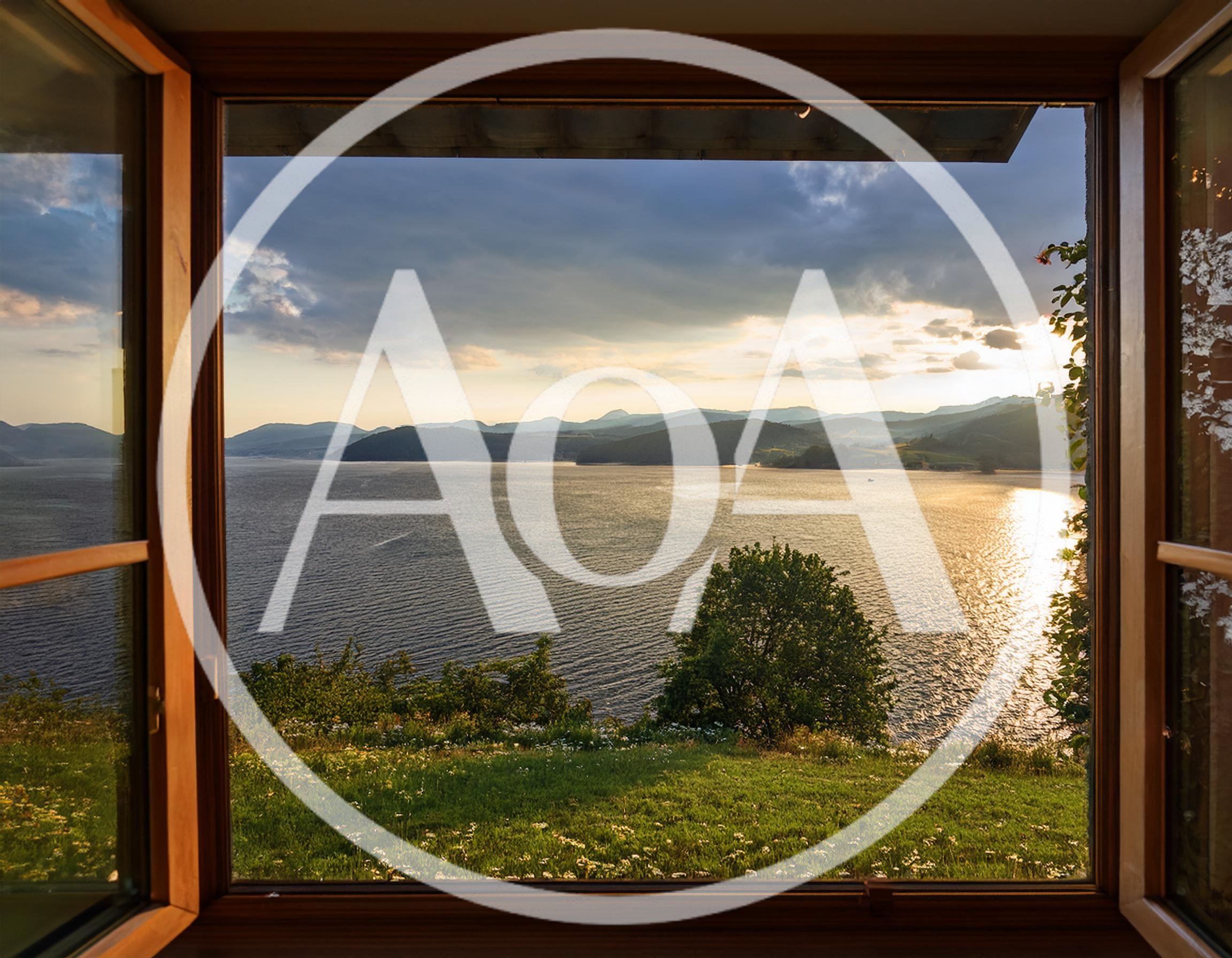 Scenic View Of A Lake At Sunset Through An Open Window