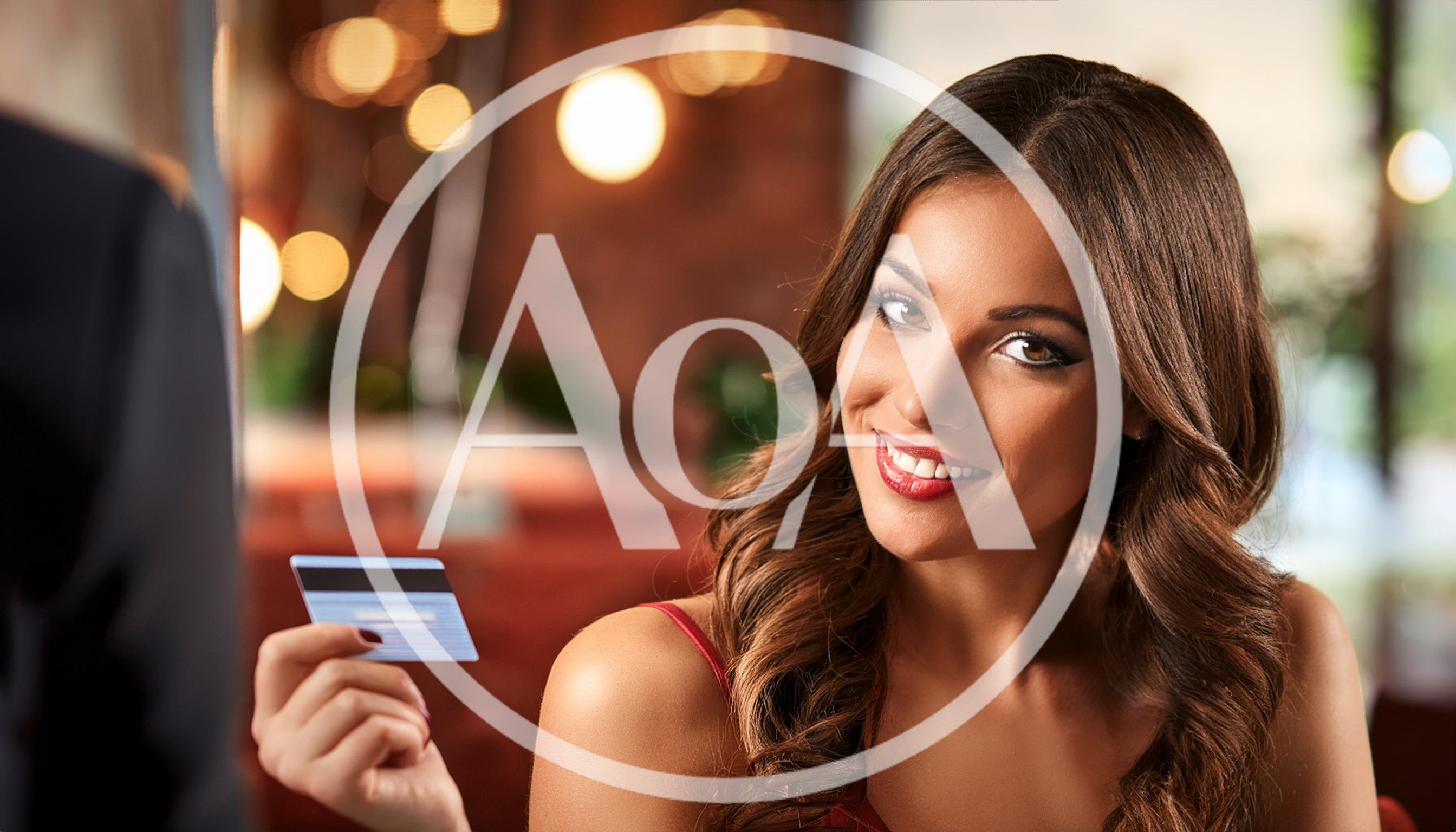 Beautiful Woman Paying With Credit Card At Restaurant
