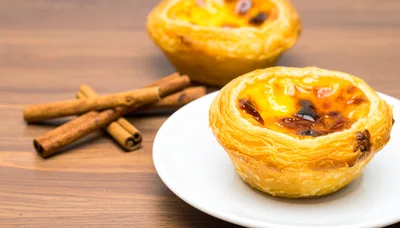 Portuguese Egg Tarts With Cinnamon Sticks