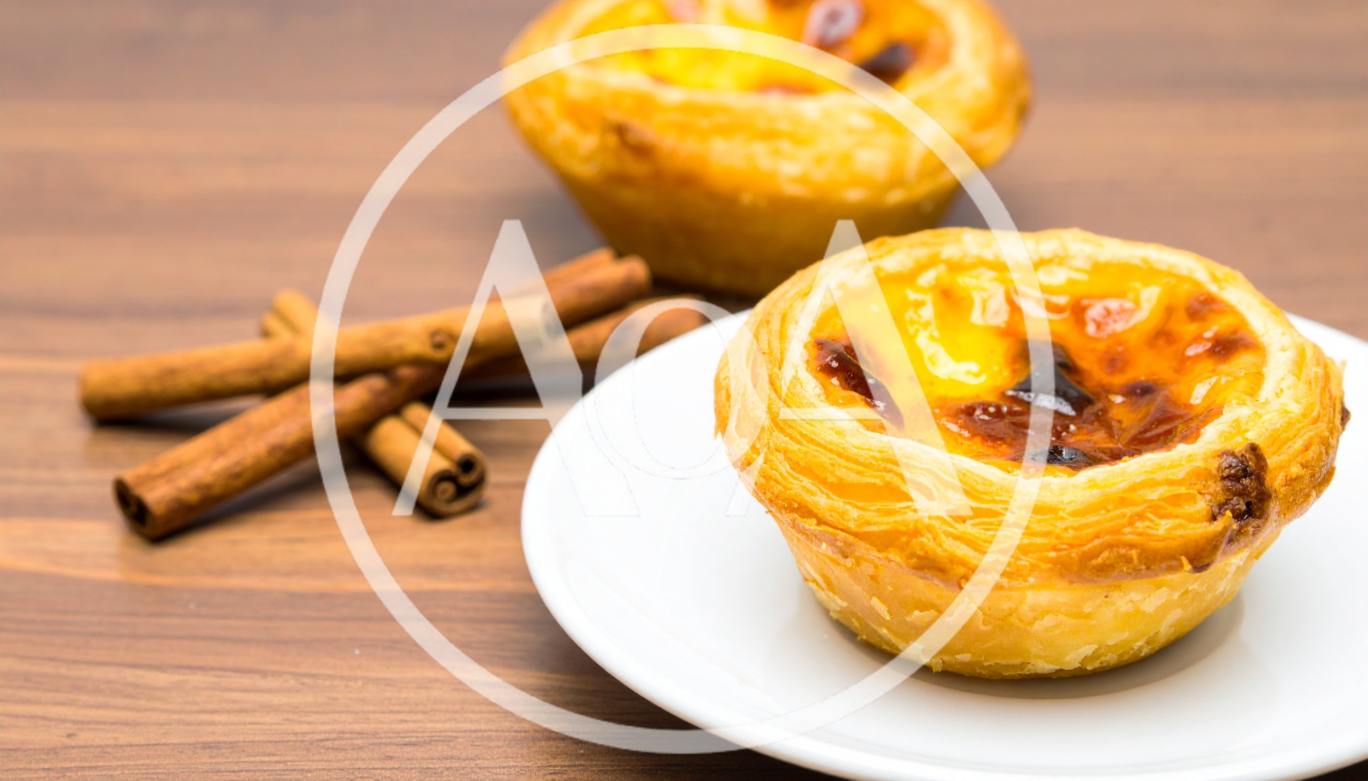 Portuguese Egg Tarts With Cinnamon Sticks