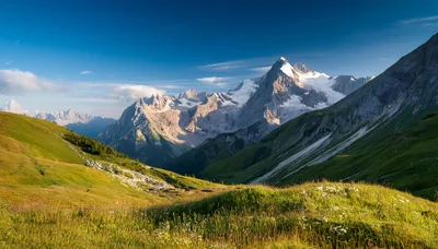 Majestic Alpine Mountain Range With Lush Green Valley