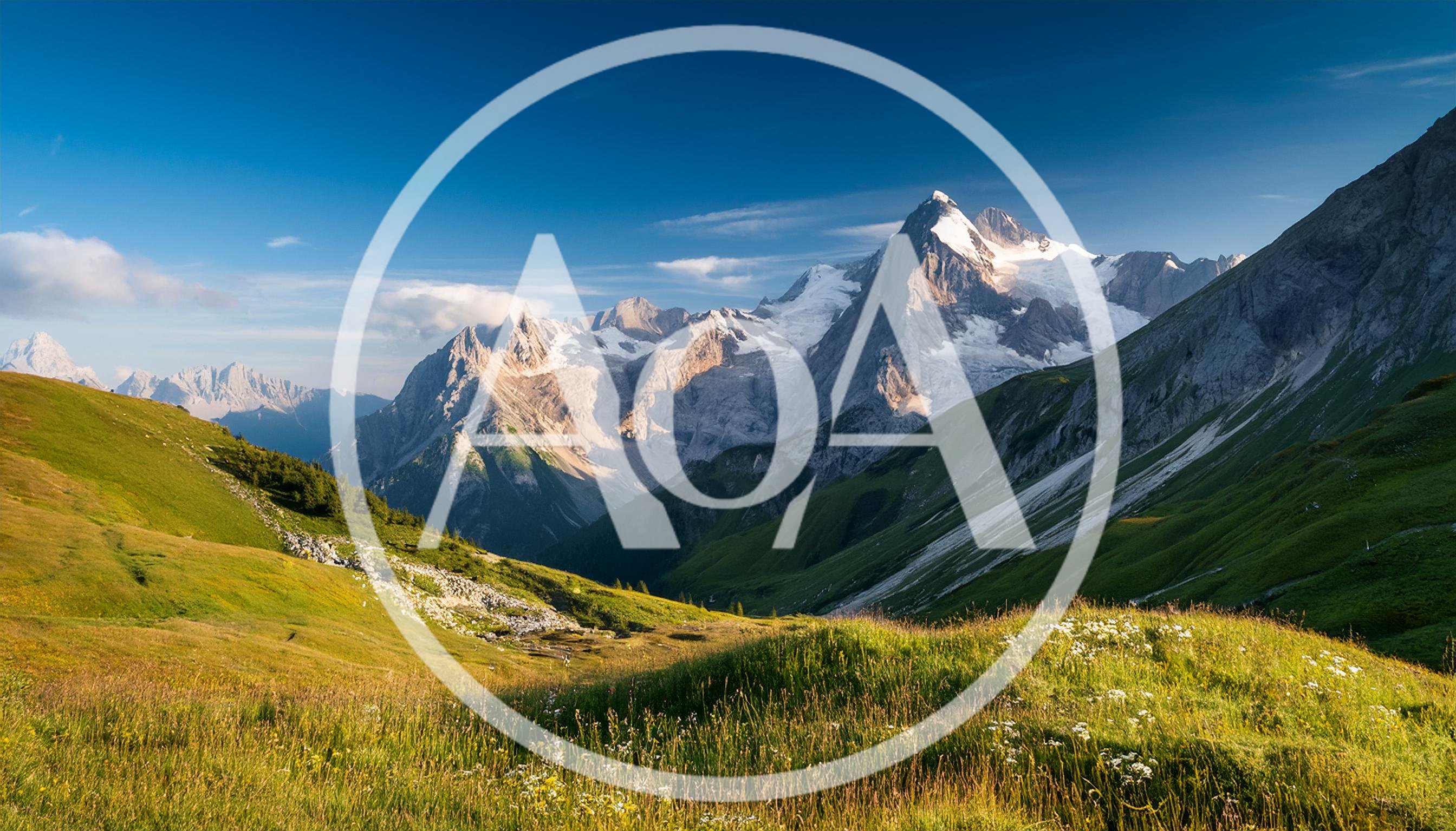 Majestic Alpine Mountain Range With Lush Green Valley