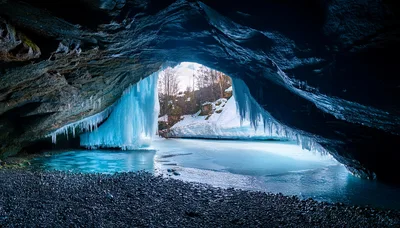 Frozen Waterfall Inside A Dark Rocky Cave