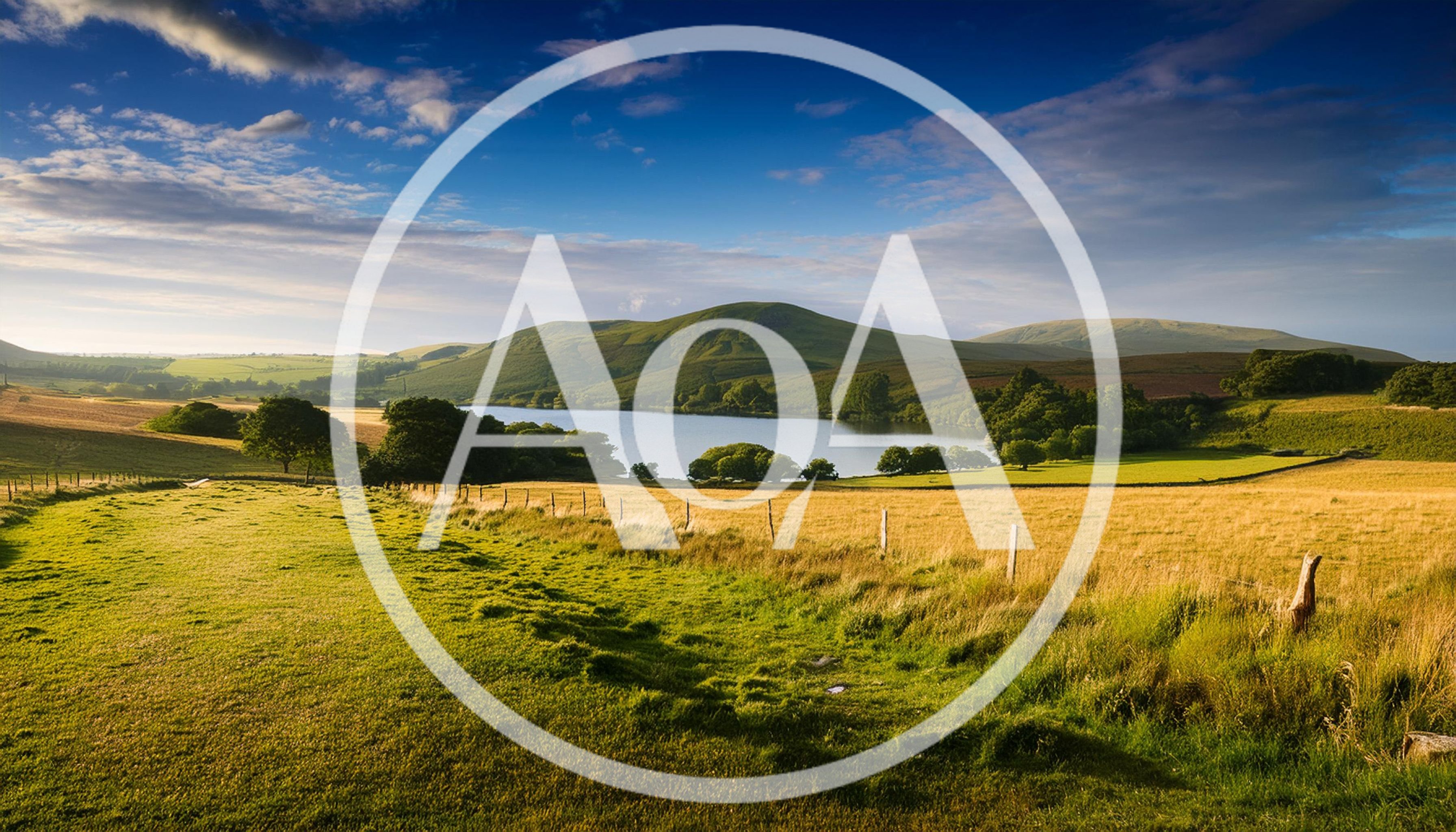 Rolling Green Hills And Lake In The English Countryside