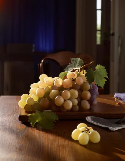 Fresh Green Grapes On A Wooden Cutting Board