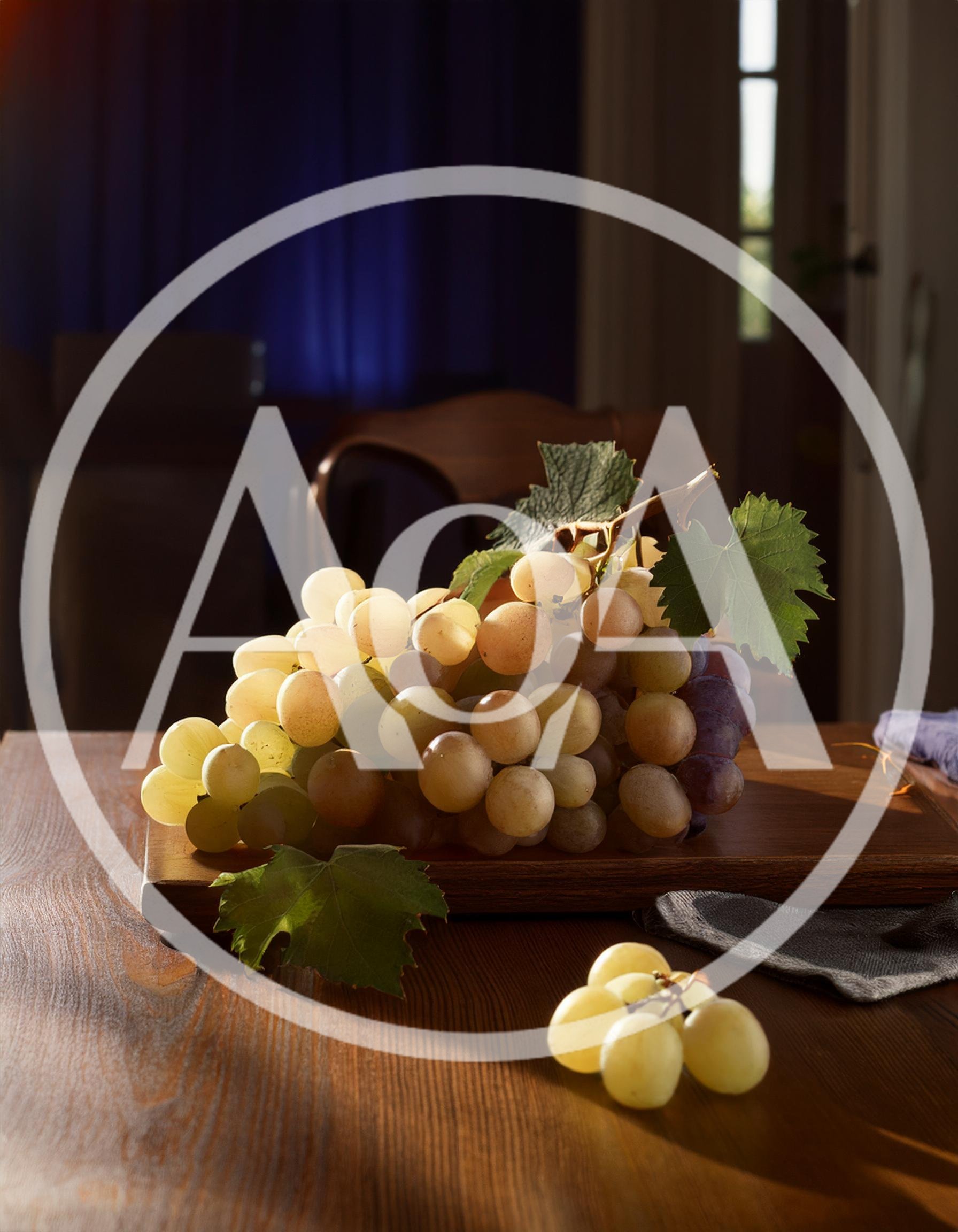 Fresh Green Grapes On A Wooden Cutting Board