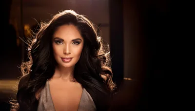Portrait Of A Glamorous Woman With Long Wavy Hair