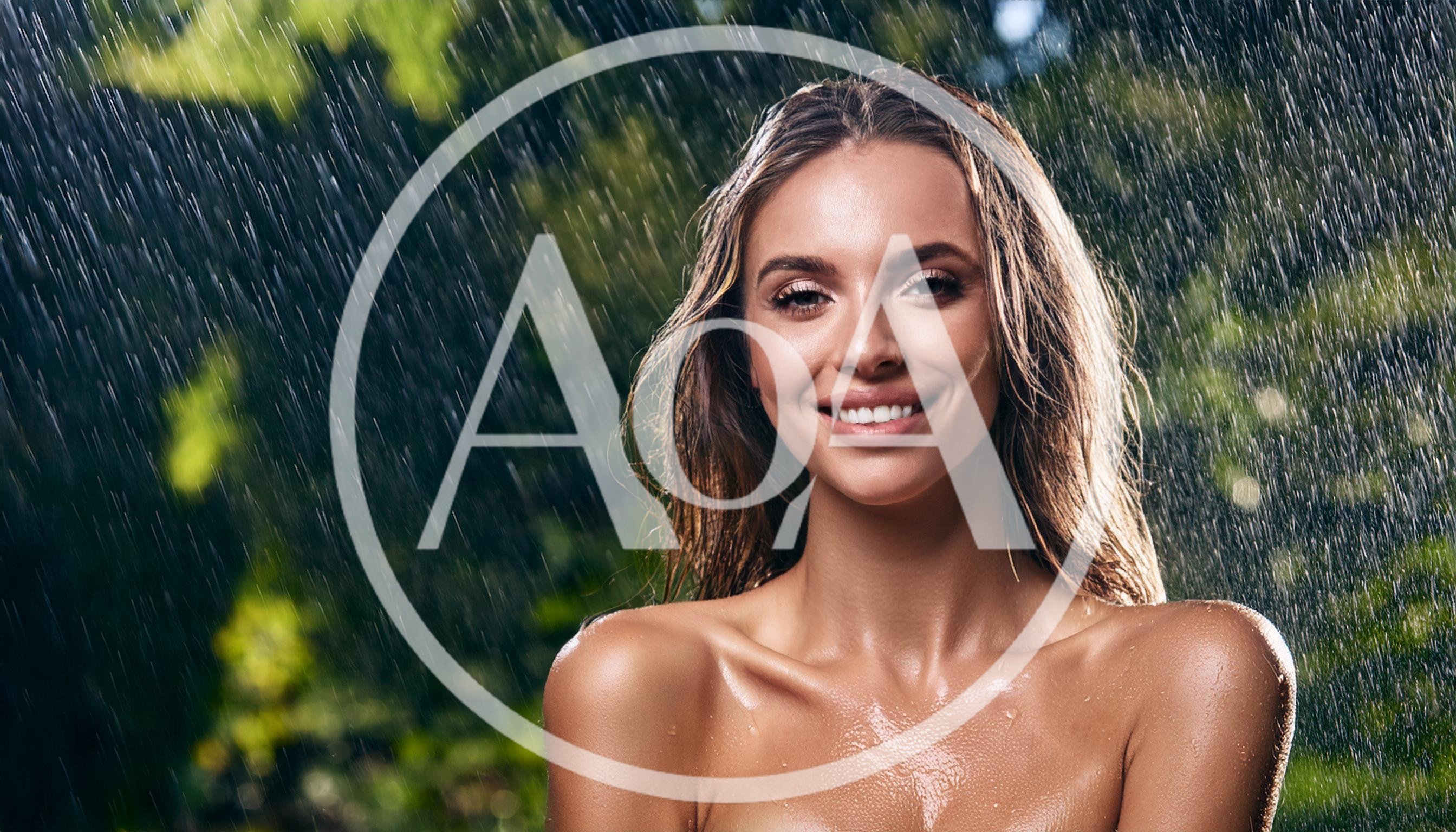 Beautiful Woman Smiling Under Rain Shower Outdoors