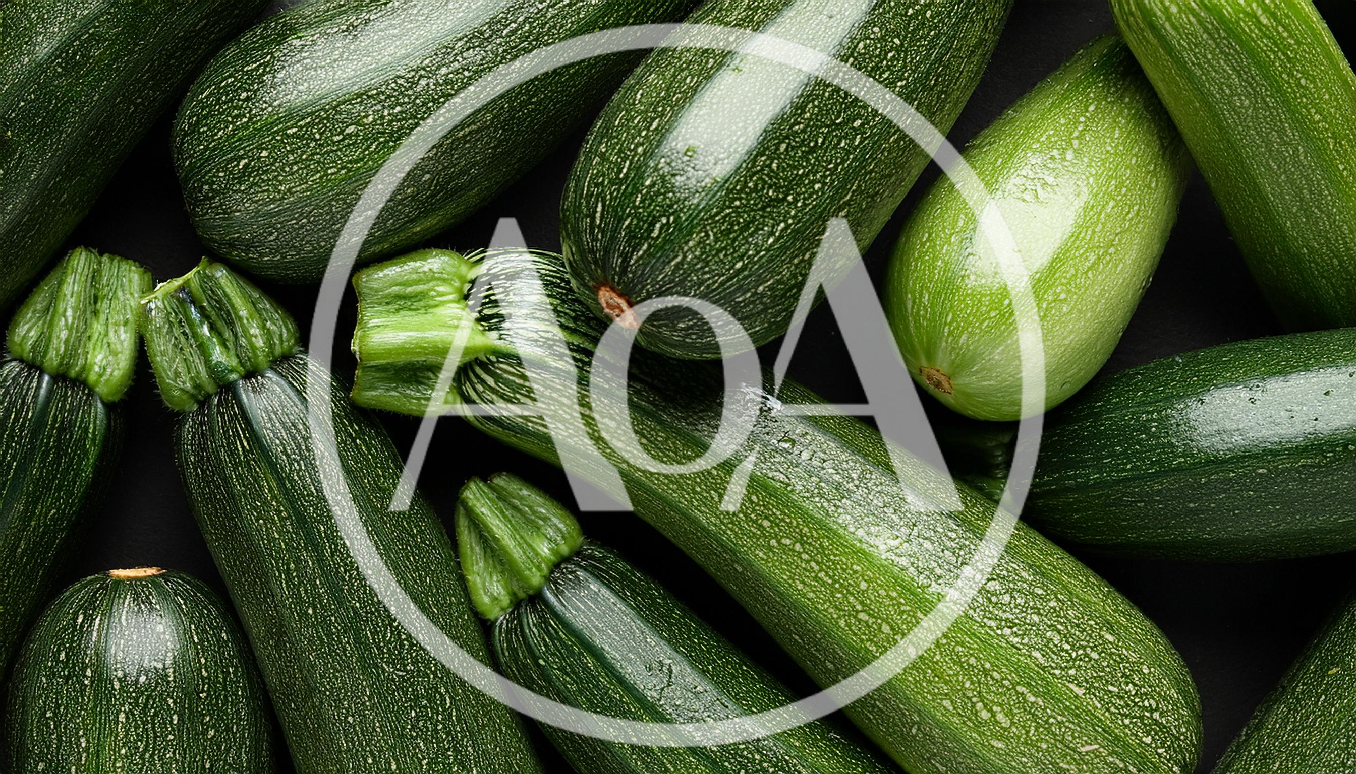 Fresh Green Zucchini Squash Arranged On Dark Background