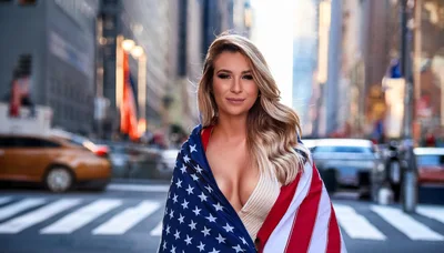 Beautiful Woman Wrapped In American Flag On City Street
