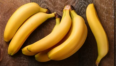 Fresh Yellow Bananas Arranged On A Wooden Surface