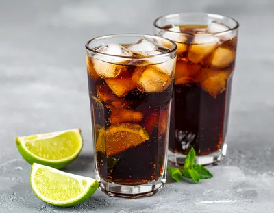 Two Glasses Of Refreshing Cola With Lime And Mint