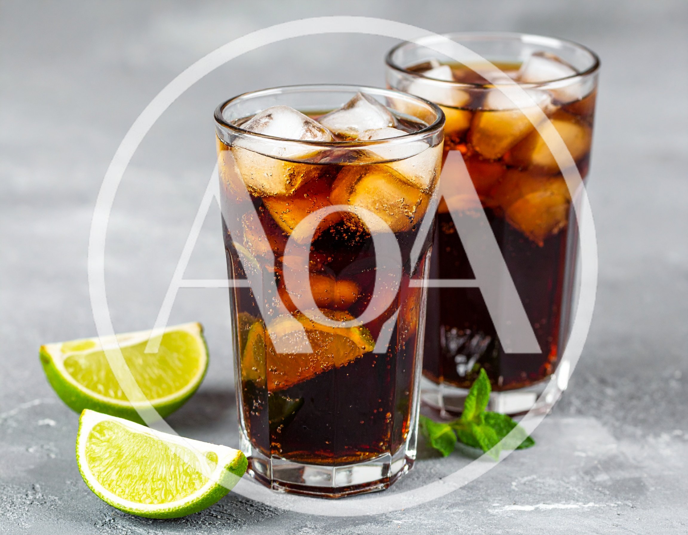 Two Glasses Of Refreshing Cola With Lime And Mint
