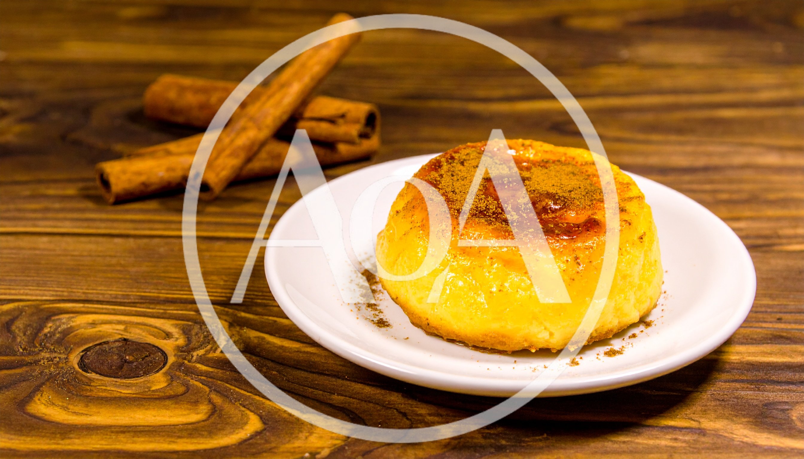 Cinnamon Topped Custard Dessert on Wooden Table