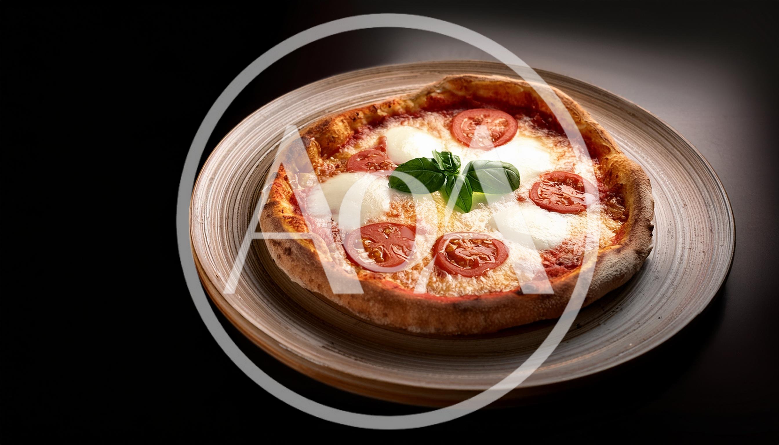 Fresh Margherita Pizza On A Rustic Ceramic Plate