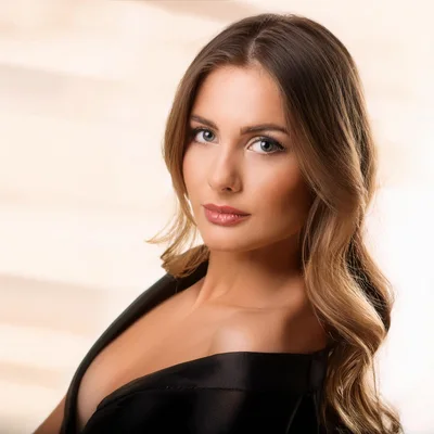 Portrait Of A Beautiful Woman In A Black Dress