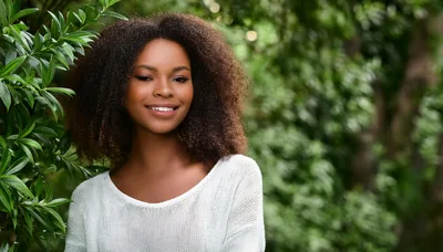 Portrait Of A Smiling Young Woman Outdoors