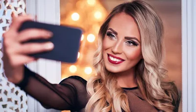 Beautiful Blonde Woman Taking A Selfie With Smartphone