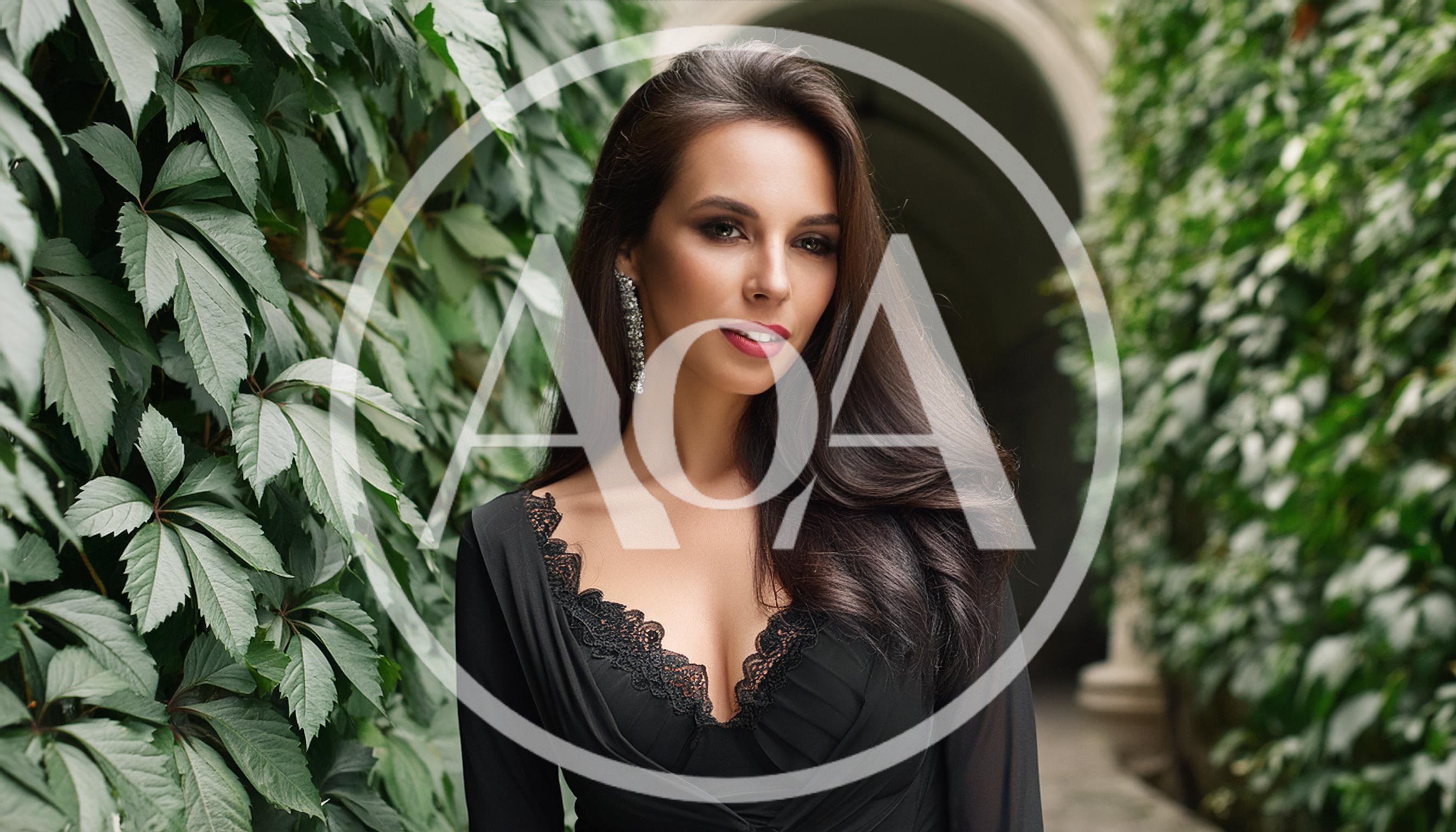 Elegant Woman Posing In A Black Lace Dress