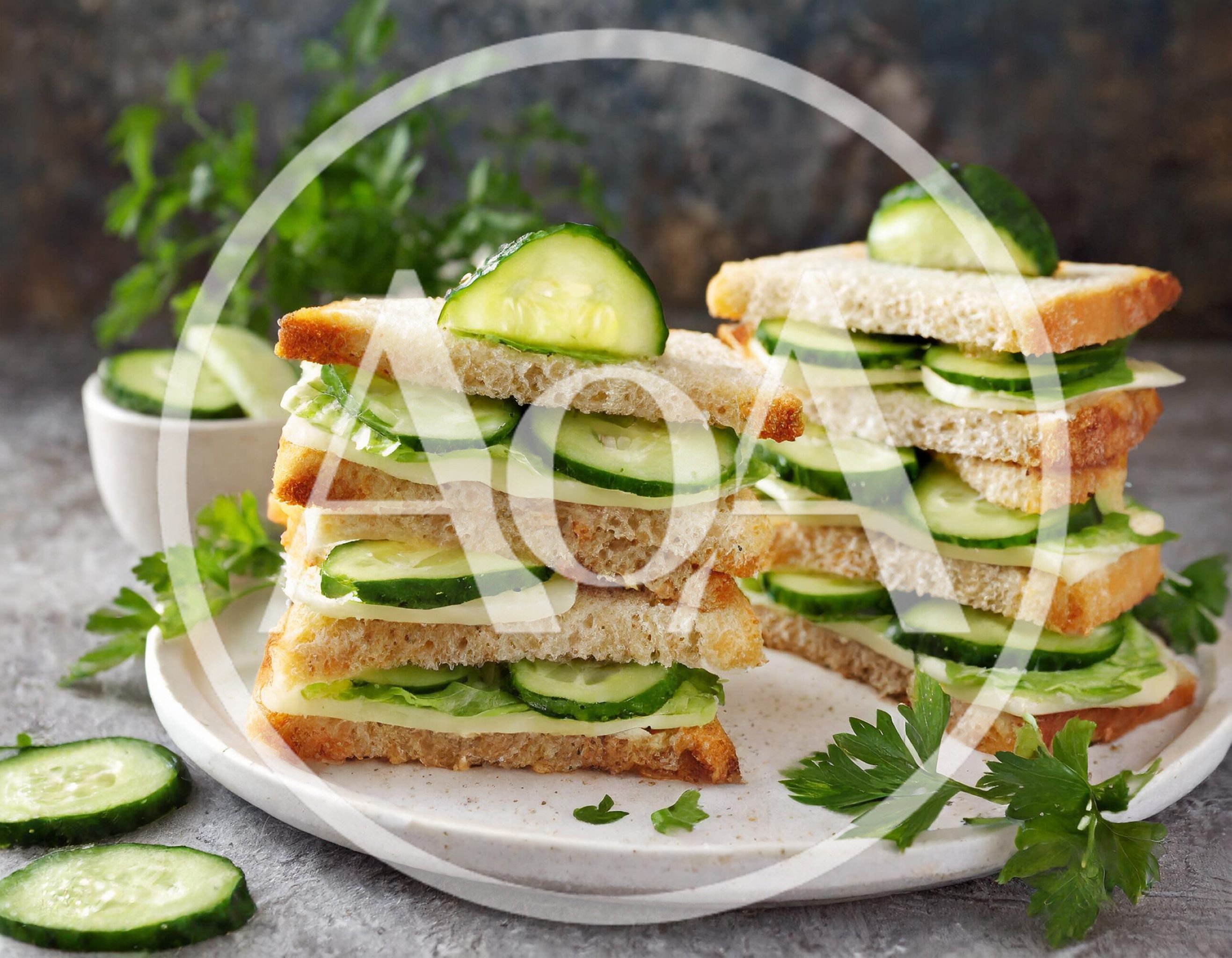 Stacked Cucumber And Cheese Sandwiches On A Plate