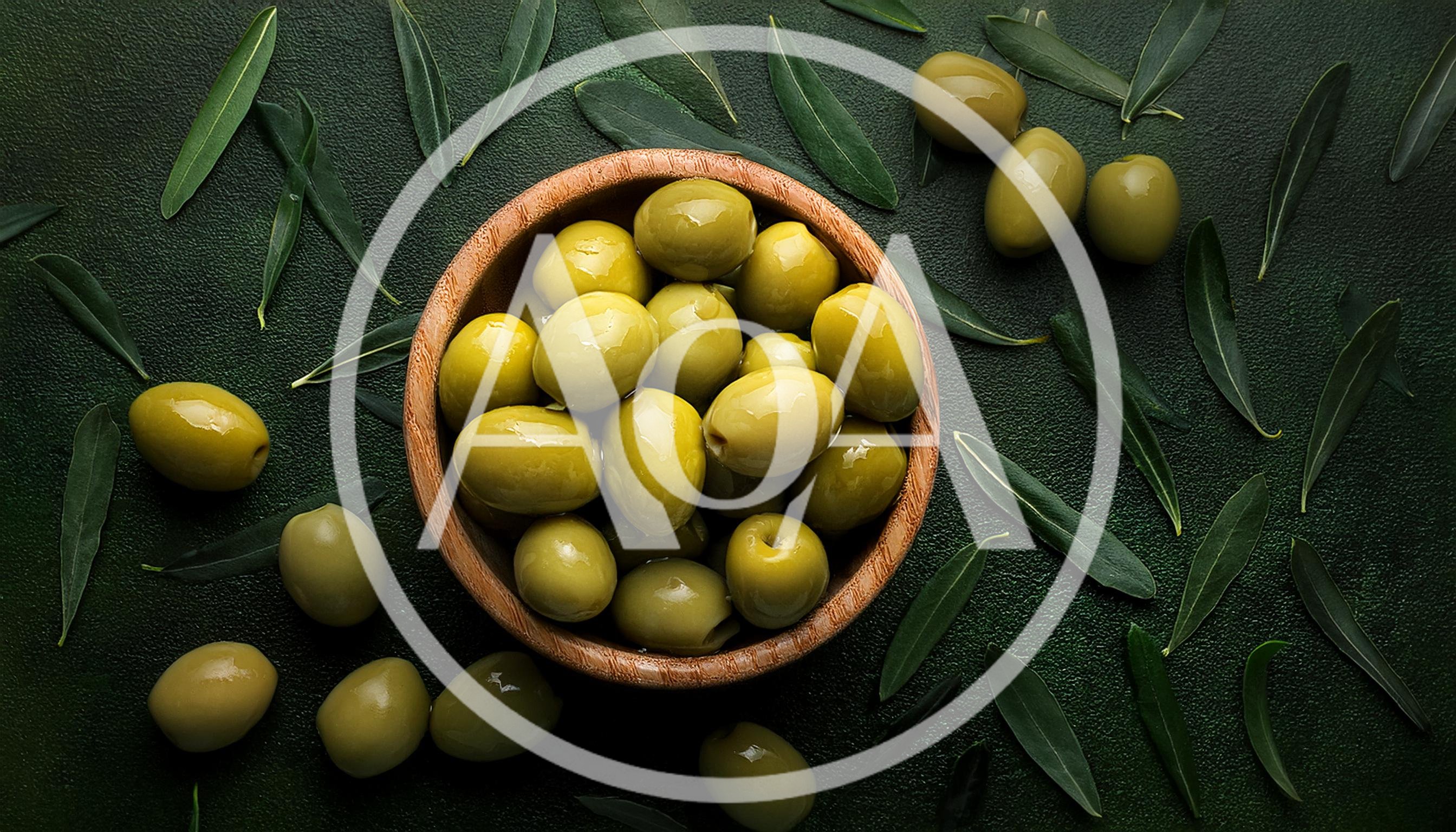Green Olives In A Wooden Bowl With Leaves