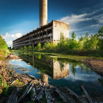 Abandoned Industrial Factory Building With Tall Smokestack