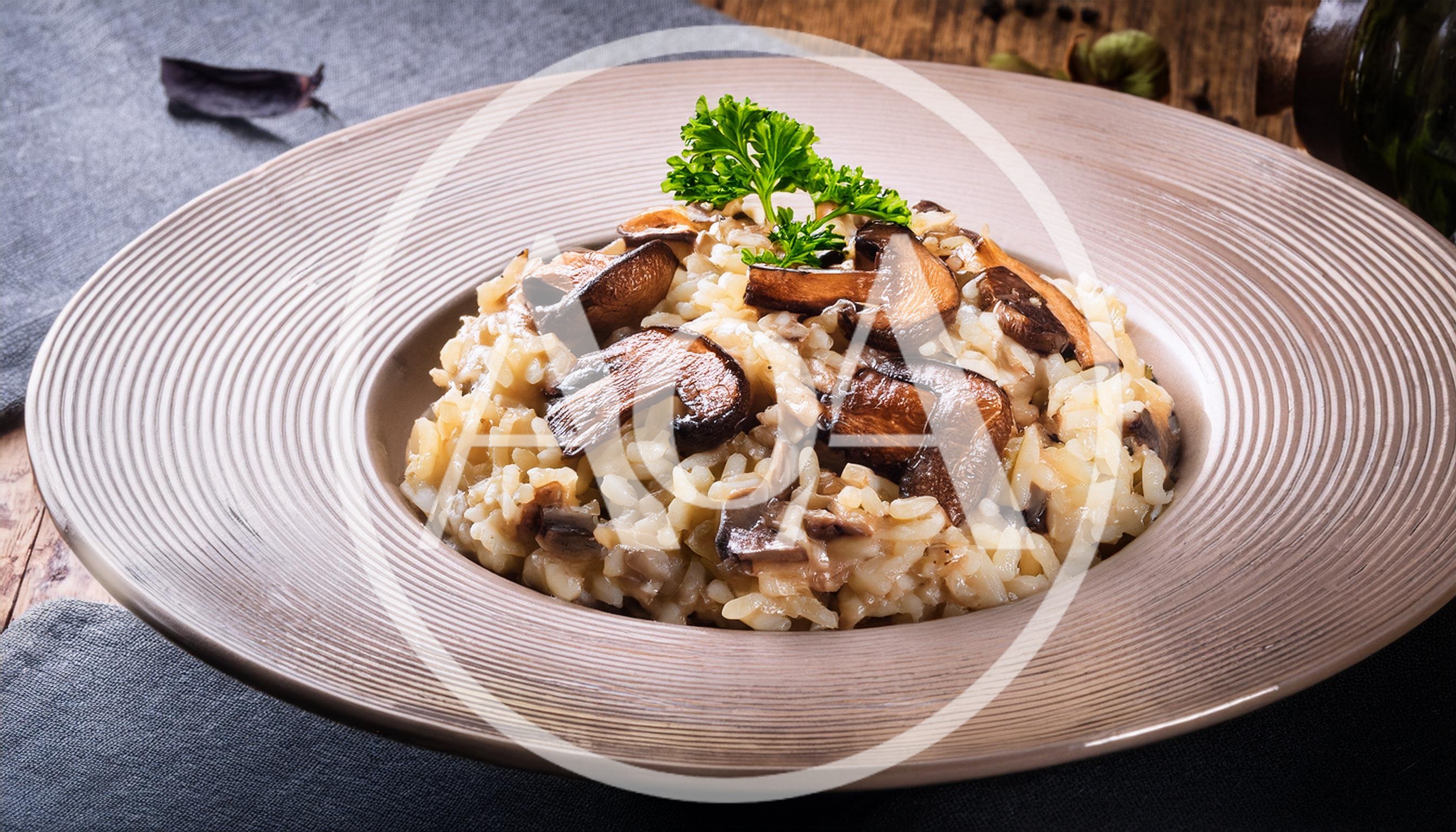 Mushroom Risotto Served In A Shallow Bowl