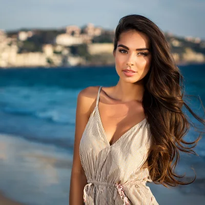 Beautiful Young Woman Posing On A Sunny Beach