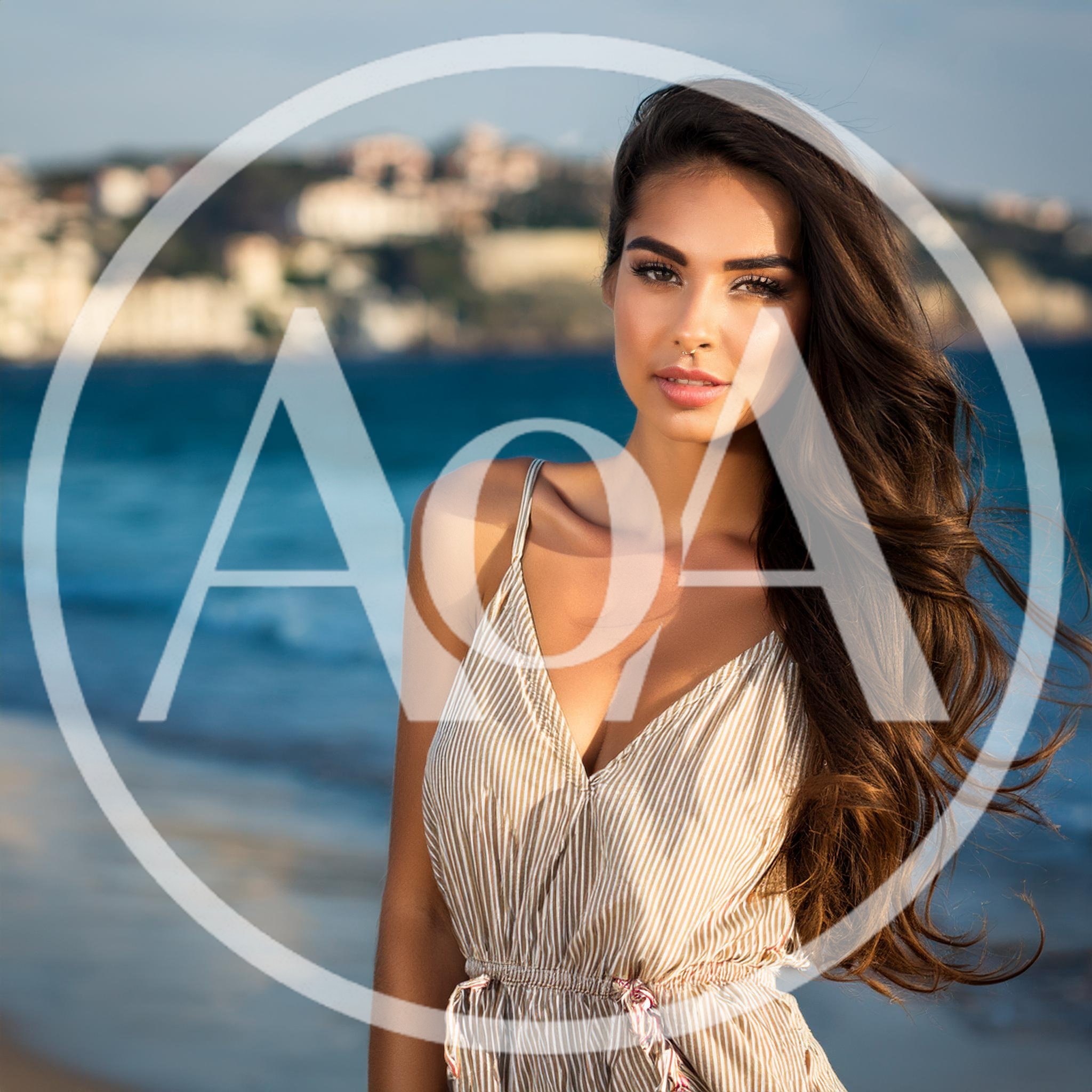 Beautiful Young Woman Posing On A Sunny Beach