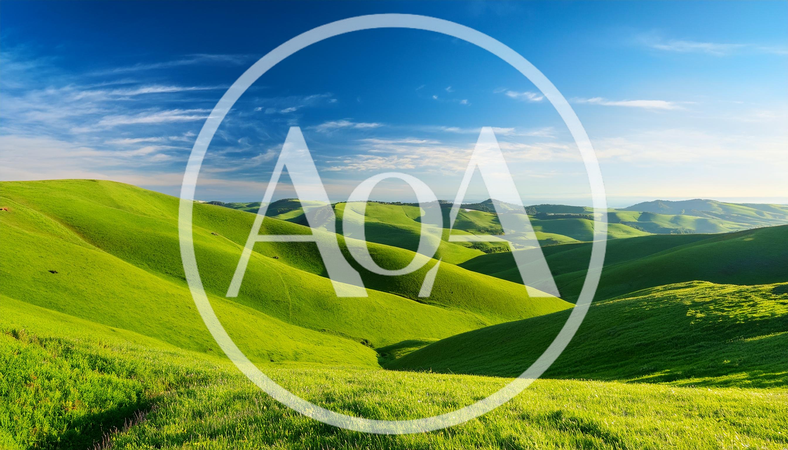 Rolling Green Hills Under A Clear Blue Sky
