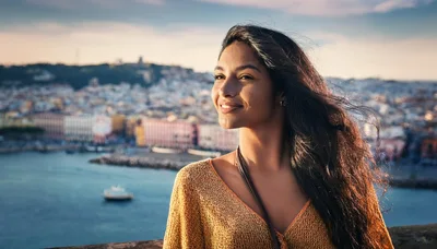 Young Woman Smiling Overlooking A Coastal Italian City