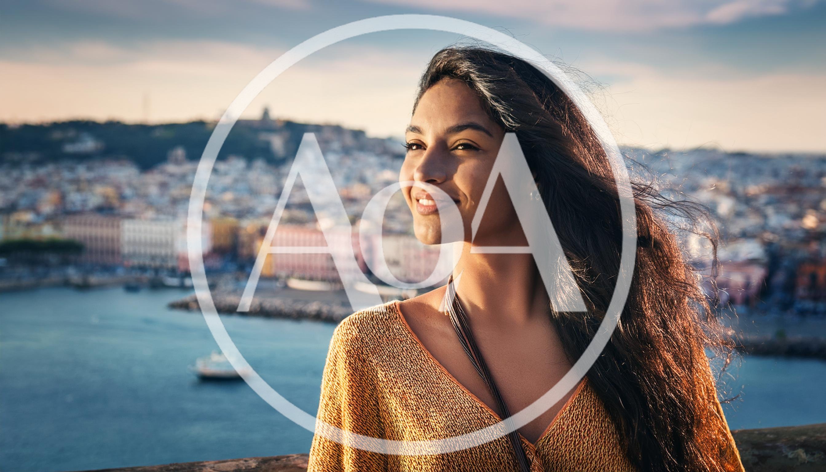 Young Woman Smiling Overlooking A Coastal Italian City
